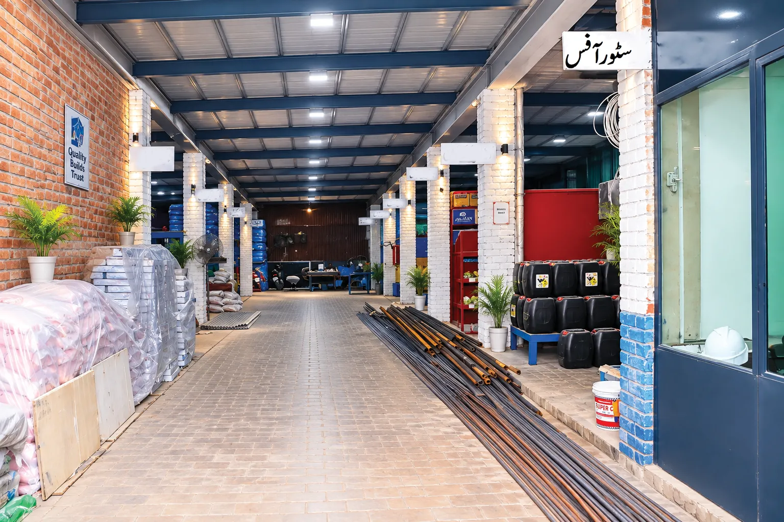 Clean factory corridor with Quality Builds Trust signage